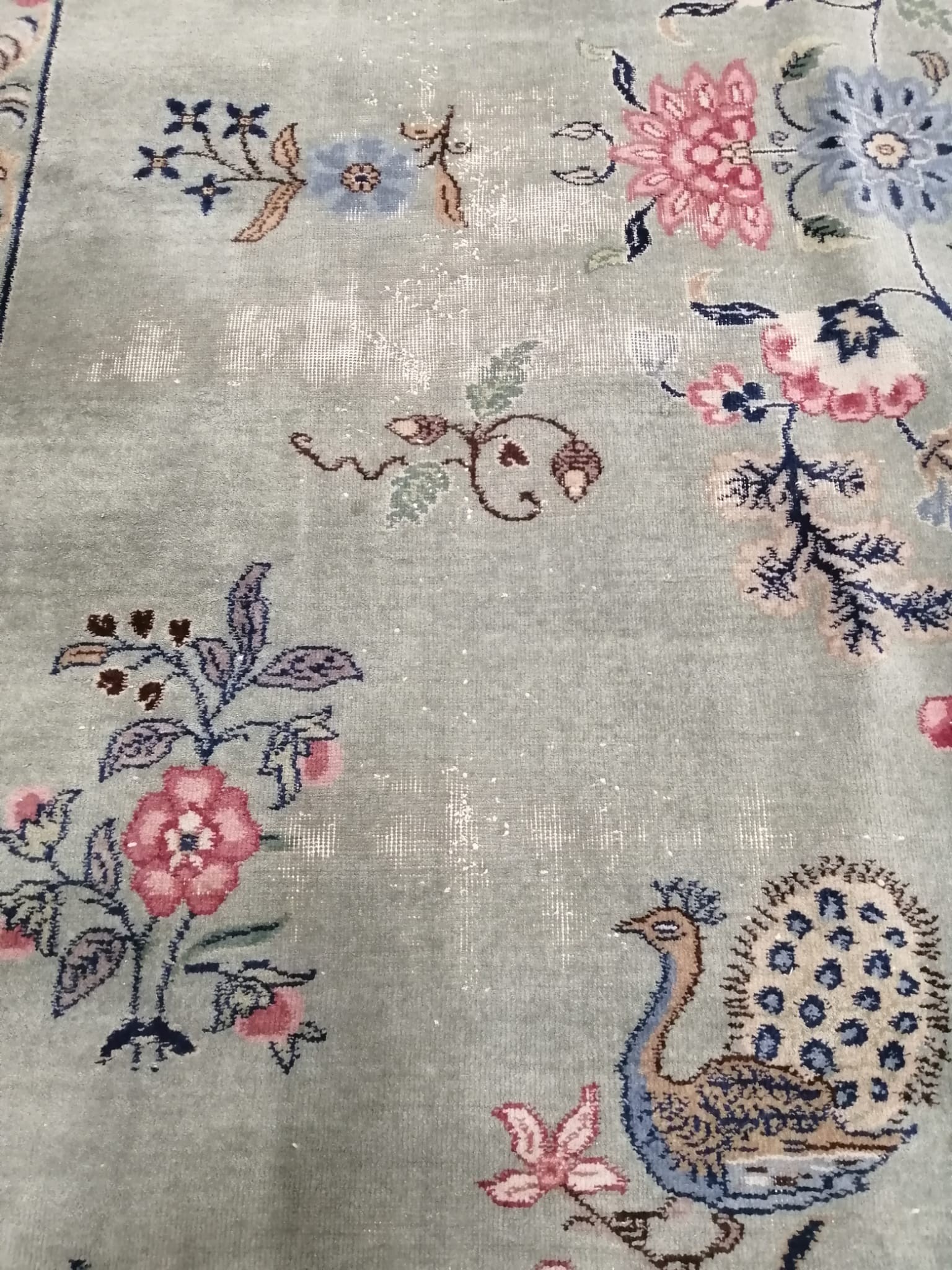 A Chinese Celadon ground floral blue ground carpet, approx. 544 x 366cm
